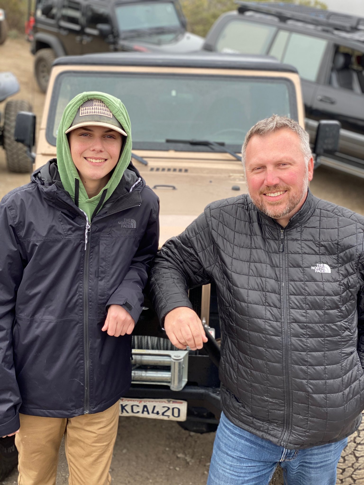 Member Feature Papa Dave Truck Family Dave Addington poses in front of his overland vehicle with his son.